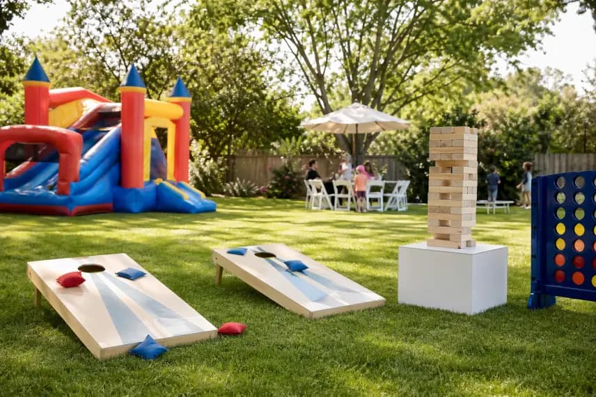 Yard game and inflatable activity rentals from Lollipop Event Rentals set up at a backyard party in Folsom, CA